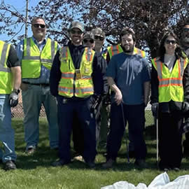 Dave Snyder, Deputy Commissioner (left) helping out with Earth Day clean-up