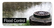 Flood Control Button showing flooded lawn with manhole